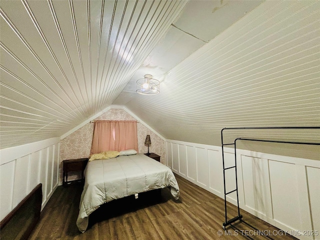 bedroom featuring vaulted ceiling and dark hardwood / wood-style floors