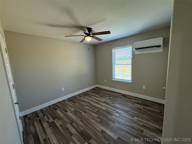 unfurnished room with dark hardwood / wood-style floors, ceiling fan, a textured ceiling, and a wall unit AC