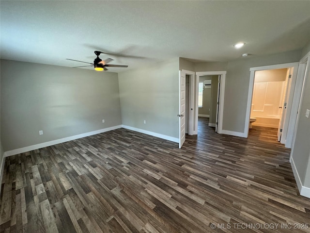 unfurnished room featuring ceiling fan and dark hardwood / wood-style floors