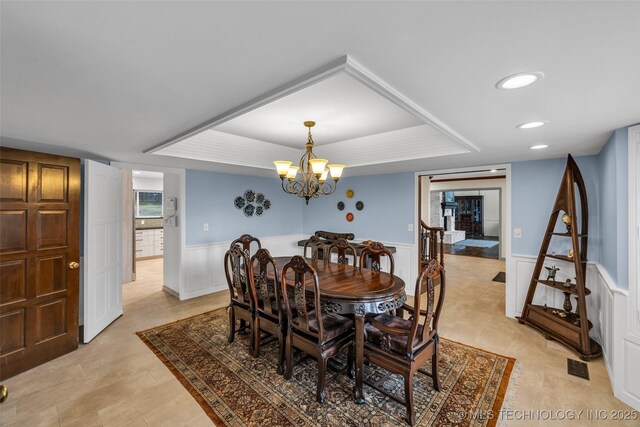 dining space featuring an inviting chandelier