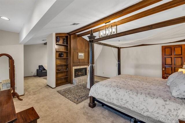 carpeted bedroom with a fireplace