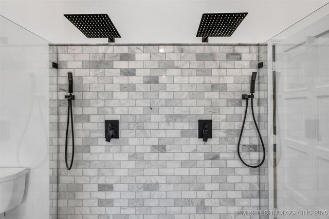 details with toilet and tiled shower