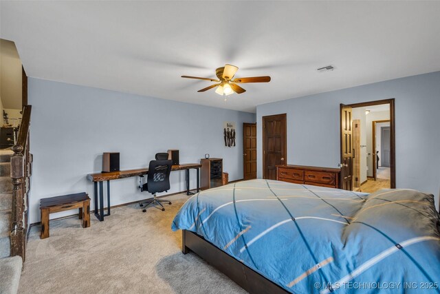 bedroom featuring ceiling fan and light colored carpet