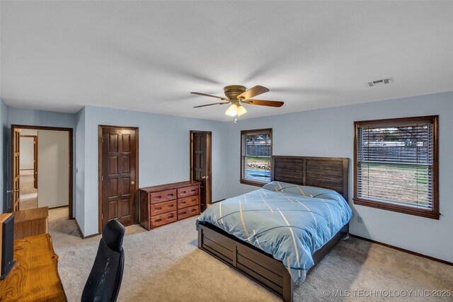 bedroom with light colored carpet and ceiling fan