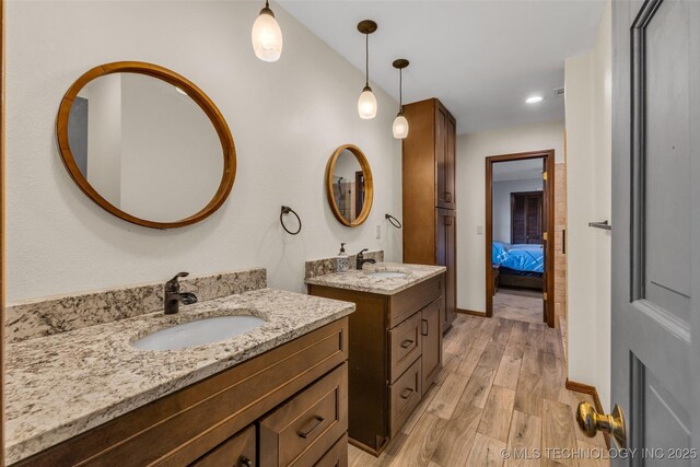 bathroom featuring vanity and hardwood / wood-style floors