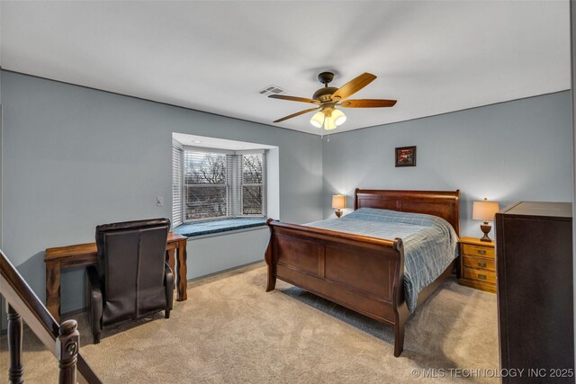 carpeted bedroom featuring ceiling fan