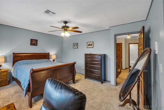 bedroom with ceiling fan and light colored carpet