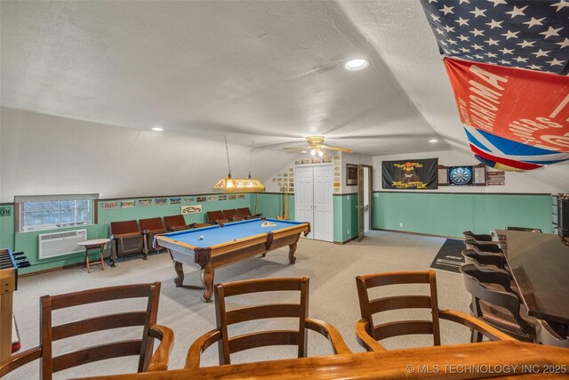 recreation room with vaulted ceiling, pool table, ceiling fan, light carpet, and a textured ceiling