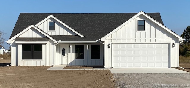 modern inspired farmhouse with a garage