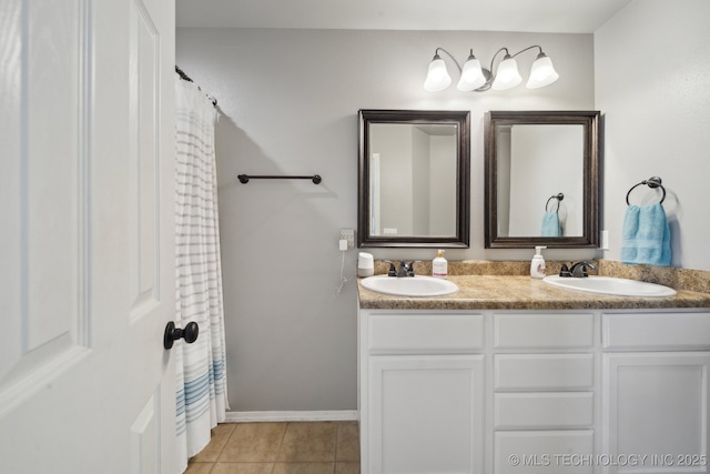 bathroom featuring tile patterned flooring and vanity