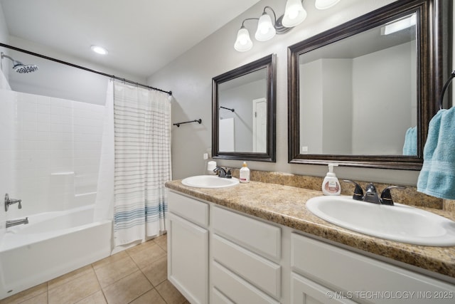 bathroom featuring tile patterned floors, vanity, and shower / bathtub combination with curtain