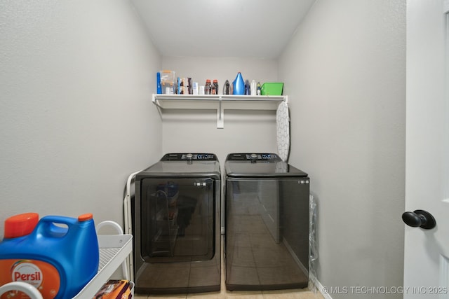 clothes washing area with washer and dryer