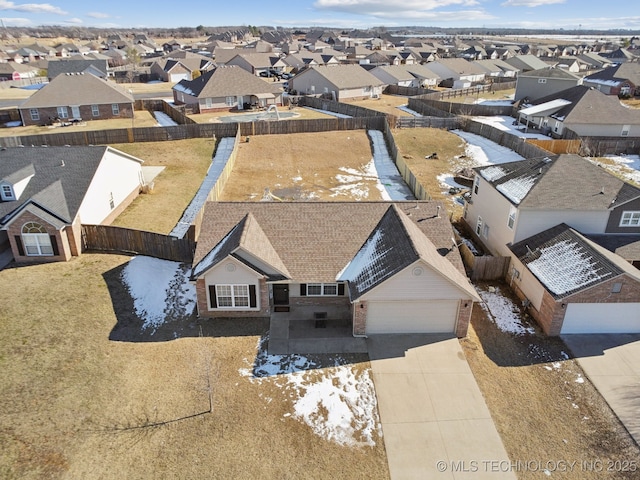 birds eye view of property with a residential view