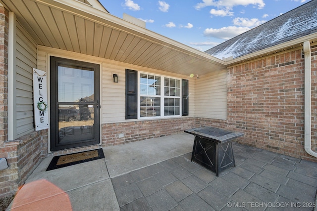 view of patio with an outdoor fire pit