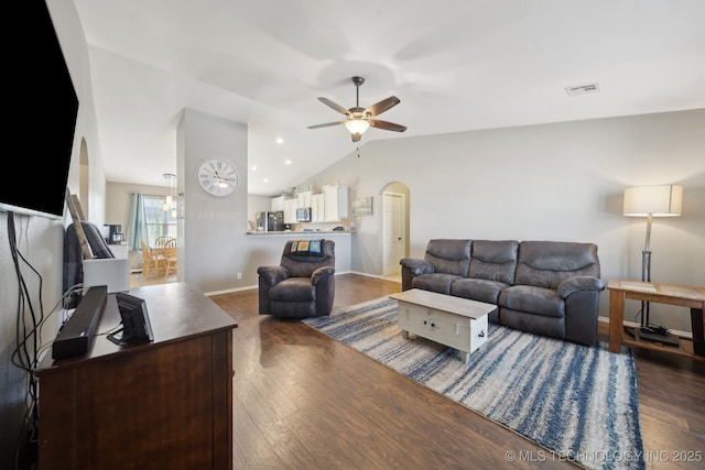 living room featuring ceiling fan, lofted ceiling, and dark wood-type flooring