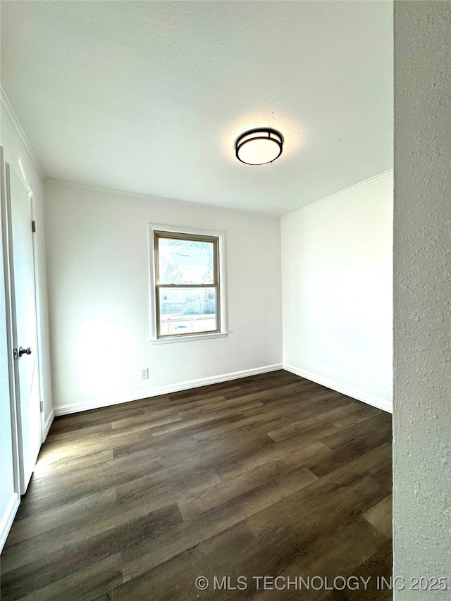 empty room with dark wood-type flooring