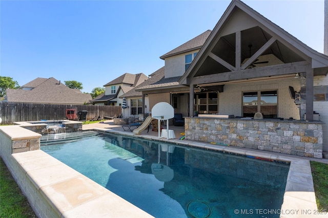 view of pool featuring a patio area and an in ground hot tub