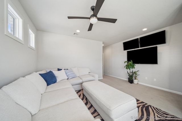 living room featuring light carpet and ceiling fan