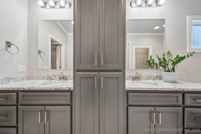 bathroom with vanity and ornamental molding