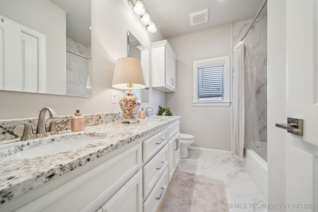 full bathroom featuring vanity, shower / tub combo, and toilet