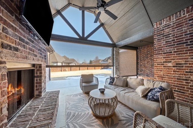 view of patio with an outdoor living space with a fireplace and ceiling fan