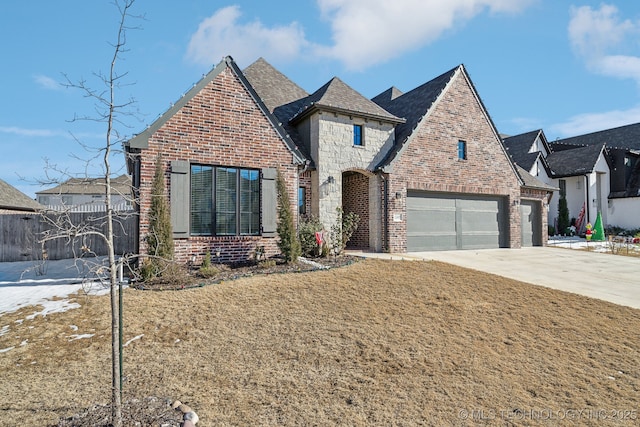 view of front of house featuring a garage and a front yard