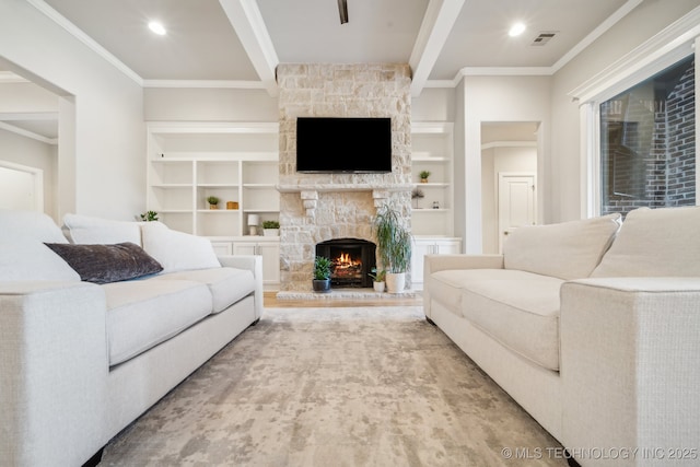 living room featuring built in shelves, a stone fireplace, and ornamental molding