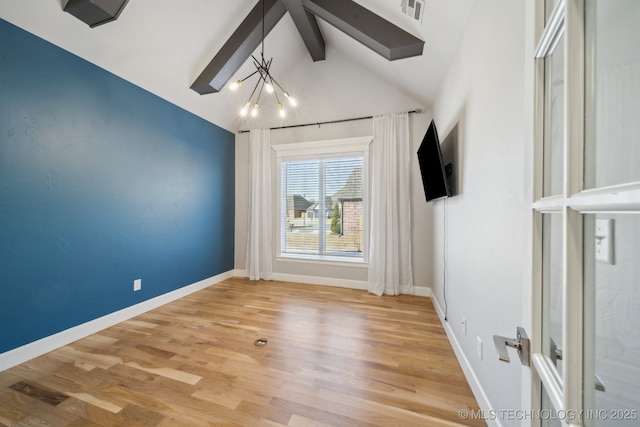 unfurnished room with a chandelier, vaulted ceiling with beams, and hardwood / wood-style flooring