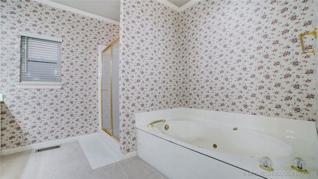 bathroom featuring ornamental molding and separate shower and tub