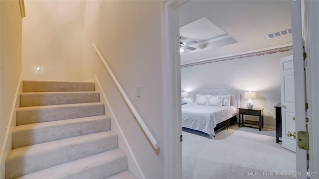 bedroom featuring ceiling fan and carpet