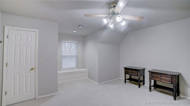 bonus room featuring ceiling fan, light colored carpet, and lofted ceiling