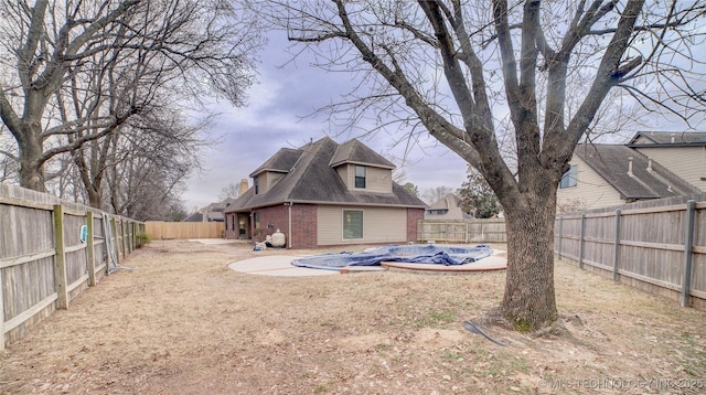 view of yard with a covered pool and a patio