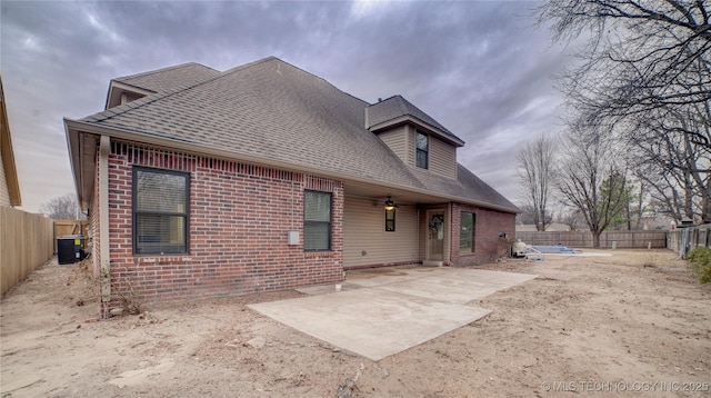 back of house with a patio and cooling unit