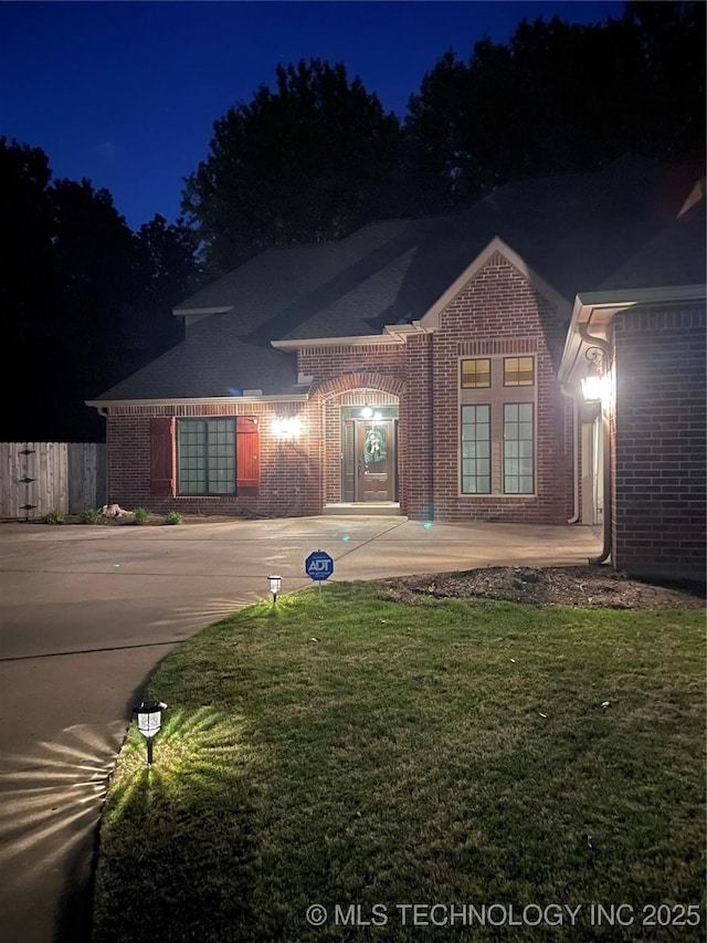 view of front of house with a yard