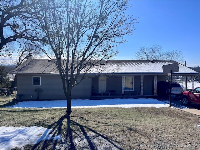 exterior space featuring a carport and covered porch