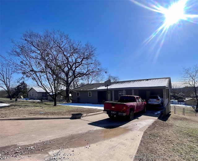 view of front of property with a carport