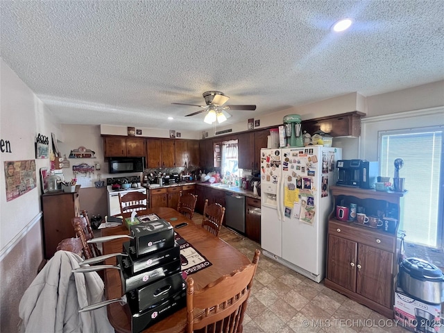 kitchen with white appliances, sink, ceiling fan, a textured ceiling, and dark brown cabinets