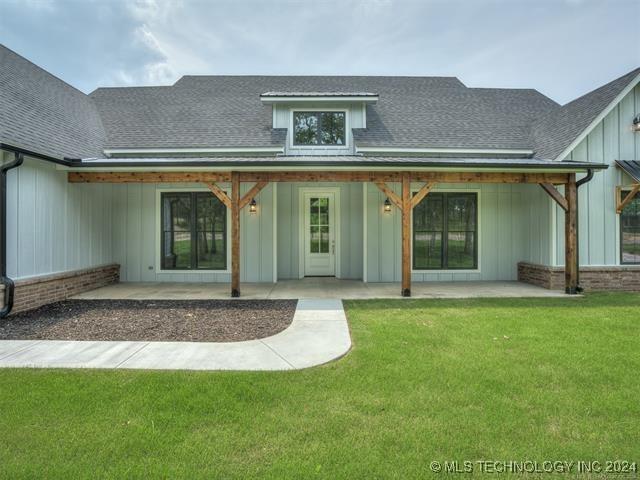 exterior space featuring a yard and a patio