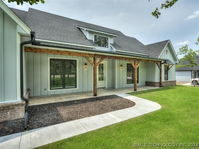 rear view of house with a lawn