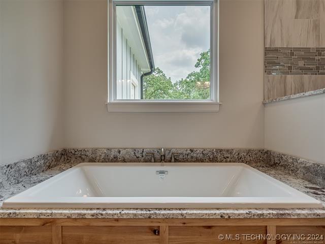 bathroom with a bathing tub