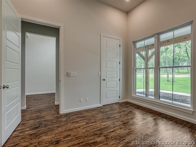 interior space with dark hardwood / wood-style flooring