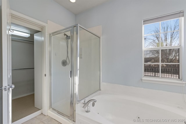 bathroom featuring separate shower and tub