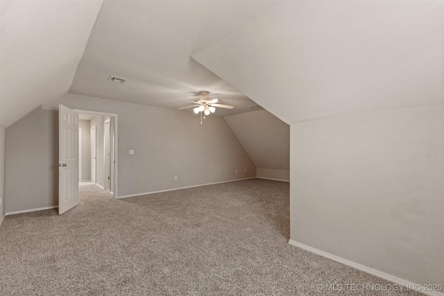 bonus room with ceiling fan, carpet floors, and vaulted ceiling