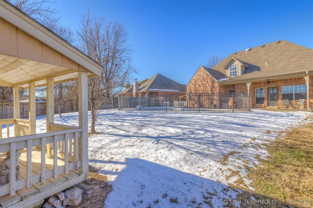 view of yard layered in snow