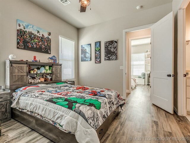 bedroom featuring ceiling fan and hardwood / wood-style floors