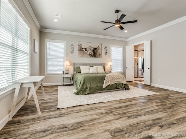 bedroom featuring hardwood / wood-style floors, ceiling fan, and ornamental molding