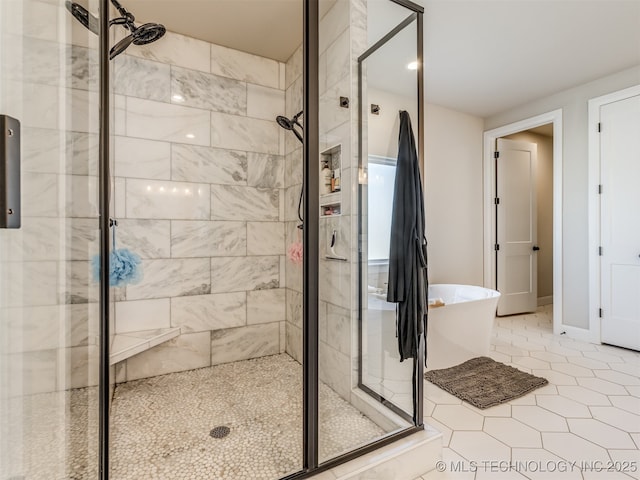 bathroom with plus walk in shower and tile patterned floors