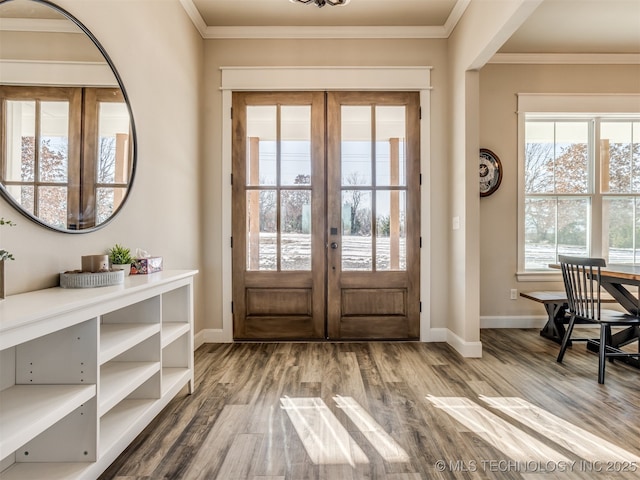 doorway to outside with ornamental molding, french doors, and hardwood / wood-style floors