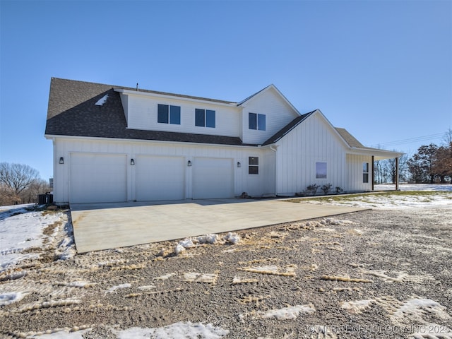 exterior space featuring central AC and a garage