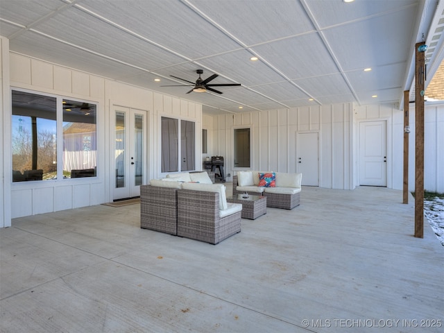 view of patio / terrace featuring ceiling fan, french doors, and an outdoor living space